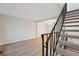 Open living area with staircase and view into the dining area at 12927 W 20Th Ave, Golden, CO 80401