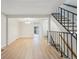Open-concept living and dining space with staircase and access to a bathroom at 12927 W 20Th Ave, Golden, CO 80401