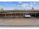 View of the carport with covered parking spaces available for residents with wood privacy fence in the background at 12927 W 20Th Ave, Golden, CO 80401