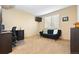 Bedroom featuring neutral color, desk, and a black futon for use as an office or guest room at 12710 W 84Th Cir, Arvada, CO 80005
