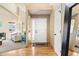 Inviting foyer with hardwood floors and ample space for greeting guests at 12710 W 84Th Cir, Arvada, CO 80005