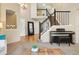 Open entryway featuring hardwood floors, stairs, and stylish decor for a grand welcome at 12710 W 84Th Cir, Arvada, CO 80005