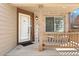 Inviting front porch with brick accents and a 'Welcome' sign for a warm greeting at 12710 W 84Th Cir, Arvada, CO 80005