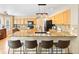 Stylish kitchen with granite countertops, island seating, and ample cabinet space at 12710 W 84Th Cir, Arvada, CO 80005