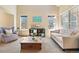 Cozy living room with comfortable seating, natural light, and a welcoming atmosphere at 12710 W 84Th Cir, Arvada, CO 80005