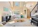Spacious living room with tall ceilings and a dining area at 12710 W 84Th Cir, Arvada, CO 80005