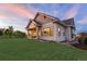 Backyard view of a modern home with landscaping and patio at 6521 S Harlan Ct, Littleton, CO 80123