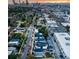 Wide aerial view of neighborhood with city skyline in background at 3443 Lawrence St, Denver, CO 80205