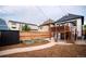 Charming backyard with deck, raised garden beds, and storage shed at 3443 Lawrence St, Denver, CO 80205