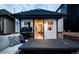 Deck with seating area and a view into a charming studio at 3443 Lawrence St, Denver, CO 80205