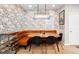 Cozy dining area with built-in banquette and modern light fixture at 3443 Lawrence St, Denver, CO 80205