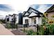 Updated craftsman home with black accents and sunflowers at 3443 Lawrence St, Denver, CO 80205