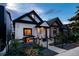 Updated craftsman home with a black fence and landscaping at 3443 Lawrence St, Denver, CO 80205