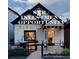 Charming two-story home featuring black and white trim, inviting entrance, and well-maintained landscaping at 3443 Lawrence St, Denver, CO 80205
