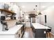Modern kitchen with white cabinets, large island, and herringbone backsplash at 3443 Lawrence St, Denver, CO 80205
