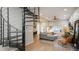 Main living area with spiral staircase and hardwood floors at 3443 Lawrence St, Denver, CO 80205