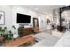Open concept living area featuring a stylish sectional sofa and kitchen views at 3443 Lawrence St, Denver, CO 80205