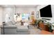Bright living room with sectional sofa and large window at 3443 Lawrence St, Denver, CO 80205