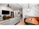 Open living room with dining area, stylish furniture, and wood floors at 3443 Lawrence St, Denver, CO 80205