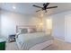 Comfortable bedroom with a ceiling fan, carpet, and a large bed for a peaceful and relaxing atmosphere at 5156 Bittercress Rd, Brighton, CO 80640
