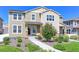 Charming two-story home featuring a landscaped front yard with a sidewalk leading to the front door at 5156 Bittercress Rd, Brighton, CO 80640