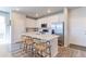 Well-equipped kitchen with a large island, stainless steel appliances and sleek white cabinetry at 5156 Bittercress Rd, Brighton, CO 80640