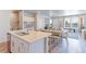 Well-equipped kitchen with a large island, stainless steel appliances and an open concept design at 5156 Bittercress Rd, Brighton, CO 80640