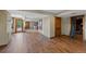 Basement area with wood floors, with doors and access to other rooms at 7056 S Owens St, Littleton, CO 80127