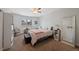 Cozy bedroom with soft carpet, shuttered windows, and ample space for a comfortable retreat at 7056 S Owens St, Littleton, CO 80127