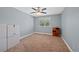 Neutral bedroom with plush carpet, a bright window, and plenty of space for furnishings at 7056 S Owens St, Littleton, CO 80127
