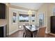 Cozy breakfast nook with large windows offering scenic views and a door leading to outdoor area at 7056 S Owens St, Littleton, CO 80127