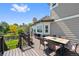 Entertain on this spacious deck with built-in grill, table, seating, and landscaped yard at 7056 S Owens St, Littleton, CO 80127