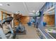 Basement exercise room with wall climbing and workout equipment with an accent wall at 7056 S Owens St, Littleton, CO 80127