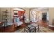 Open-concept living space with hardwood floors and comfortable seating at 7056 S Owens St, Littleton, CO 80127