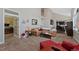Comfortable living room showcasing an open floor plan with adjacent kitchen, and neutral color palette at 7056 S Owens St, Littleton, CO 80127