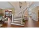 Open staircase with a view of the living room and dining room at 7056 S Owens St, Littleton, CO 80127