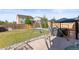 Fenced backyard featuring a patio with gazebo, swing set, and well-maintained lawn, perfect for outdoor enjoyment at 14920 Munich Ave, Parker, CO 80134