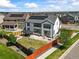 Aerial view of a backyard with a well-maintained lawn, fence, and patio with outdoor furniture and solar panels at 14920 Munich Ave, Parker, CO 80134