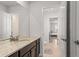Bathroom with granite countertops, dark cabinets, and tile flooring and shower at 14920 Munich Ave, Parker, CO 80134