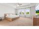 Bright bedroom with a ceiling fan and lots of natural light from the large window at 14920 Munich Ave, Parker, CO 80134