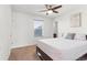 This bedroom features lots of natural light, a ceiling fan, and neutral paint at 14920 Munich Ave, Parker, CO 80134