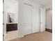 Bedroom featuring closet and ensuite bathroom at 14920 Munich Ave, Parker, CO 80134