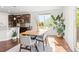 Bright dining area with a large window and view of the kitchen, perfect for entertaining at 14920 Munich Ave, Parker, CO 80134