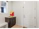 Bright entryway boasting a charming cabinet with granite countertop and adjacent bench seating at 14920 Munich Ave, Parker, CO 80134