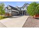 Beautiful home boasting a spacious driveway, two-car garage, and charming curb appeal at 14920 Munich Ave, Parker, CO 80134