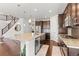 Spacious kitchen with stainless steel appliances, a large island, and hardwood floors at 14920 Munich Ave, Parker, CO 80134