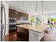 Bright kitchen featuring a large island with granite countertops and stainless steel appliances at 14920 Munich Ave, Parker, CO 80134