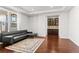 Stylish living room with a wet bar area, dark wood floors, and tray ceilings at 14920 Munich Ave, Parker, CO 80134
