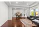 Inviting living room featuring hardwood floors, natural light, and a comfortable seating area at 14920 Munich Ave, Parker, CO 80134
