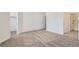 Bright, carpeted bedroom with an ensuite bathroom and a walk-in closet for ample storage space at 2006 S Haleyville Way, Aurora, CO 80018